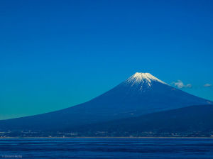 Here's an actual view of Mt. Fuji across Suruga Bay. Source: Wikimedia Commons, photographer: Shinichi Morita